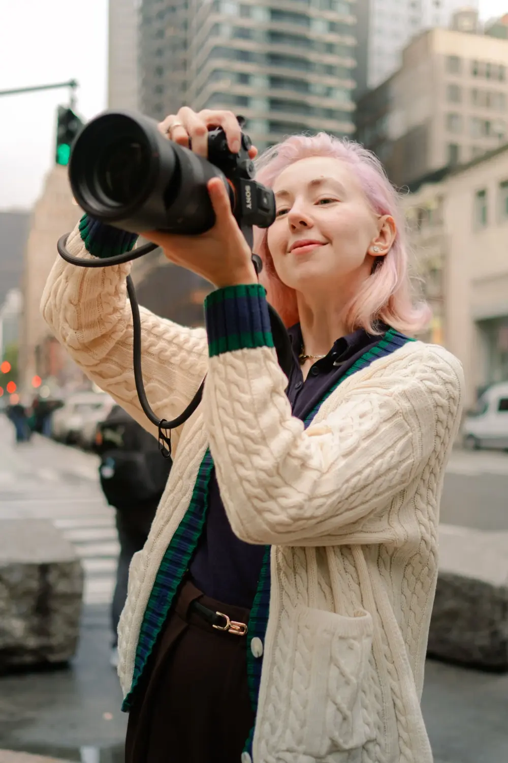 Photographer Eleanor Vinogradova holding camera in natural light